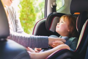 Toddler girl in her car seat