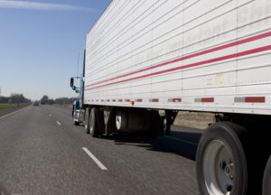 Semi truck haulling freight down the highway