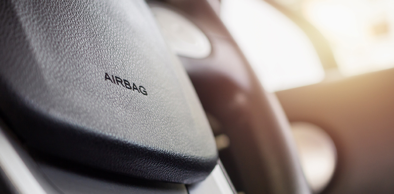 Close of up steering where with stamped "air bag" word