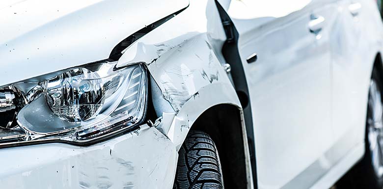 White car with front damage