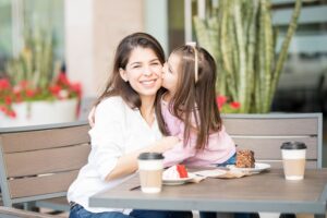 mother and daughter together at a cafe