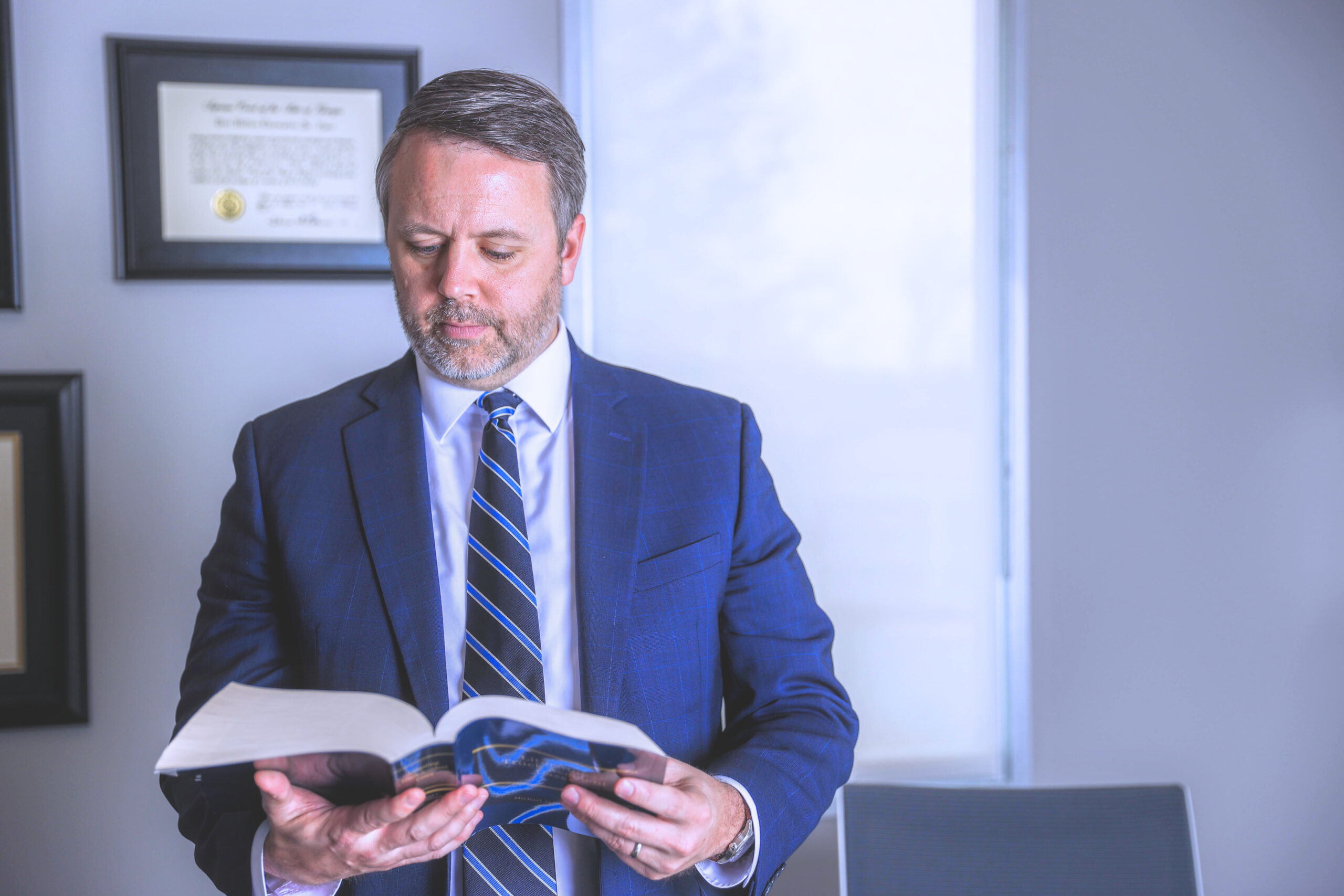 attorney reading legal book