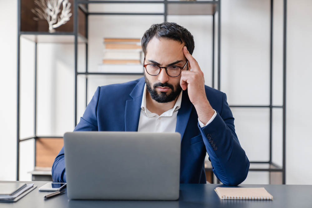 lawyer looking skeptically at computer