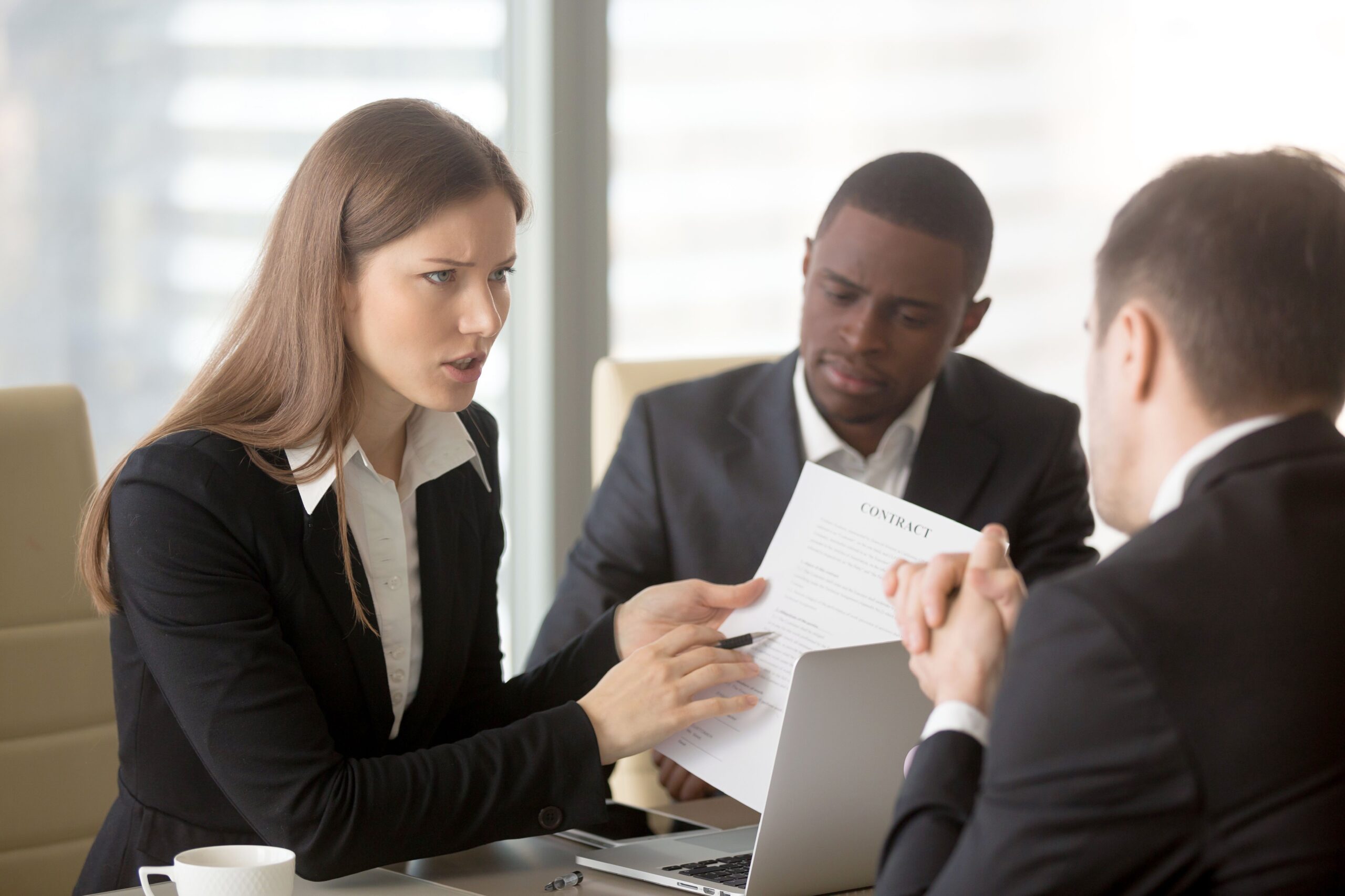 lawyers looking at legal contract