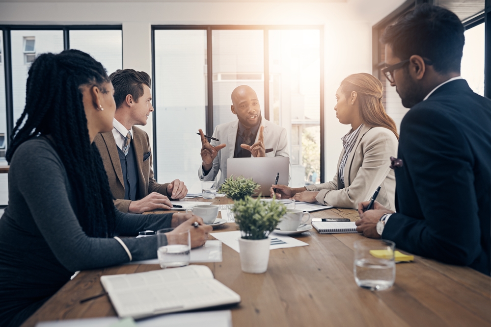 legal team sitting around a table