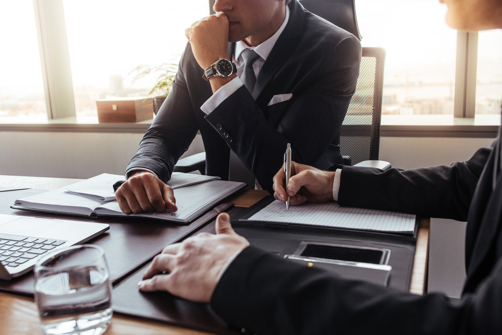 concerned lawyer sitting at desk