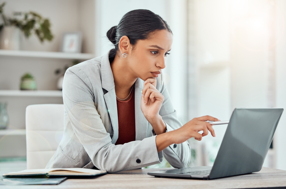 female lawyer thinking looking at computer